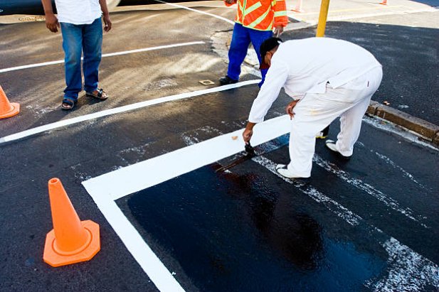 How Do Sealcoating Services Protect Against Oil Stains?